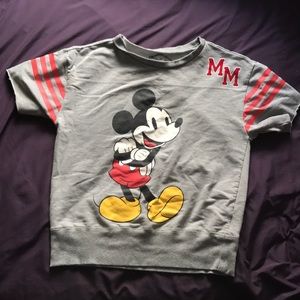 A disney mickey mouse shirt in the size medium